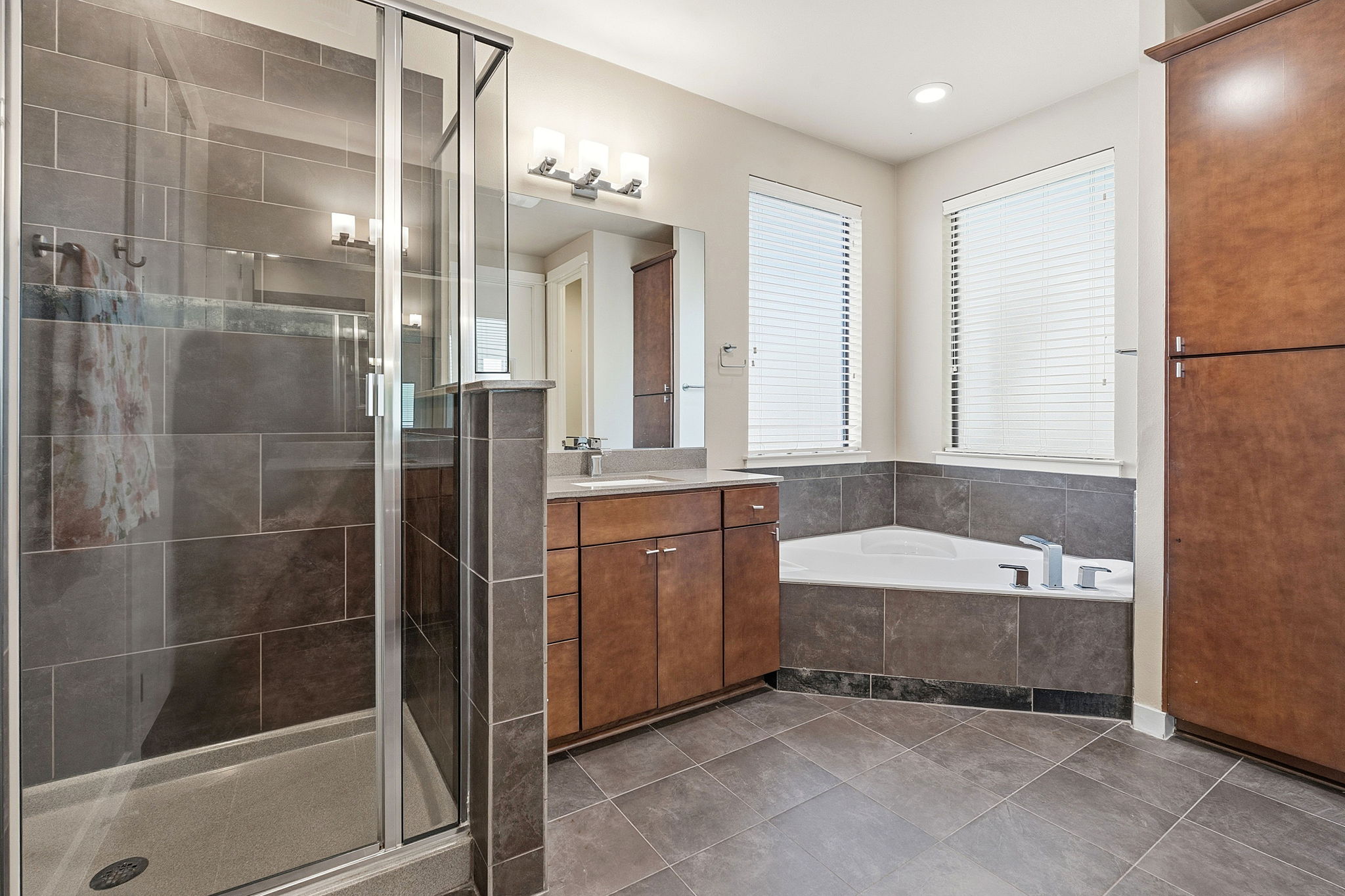 2911 Corbin Lane Austin, TX 78704 - Photo 16 of 37 a bathroom with a tub shower and sink