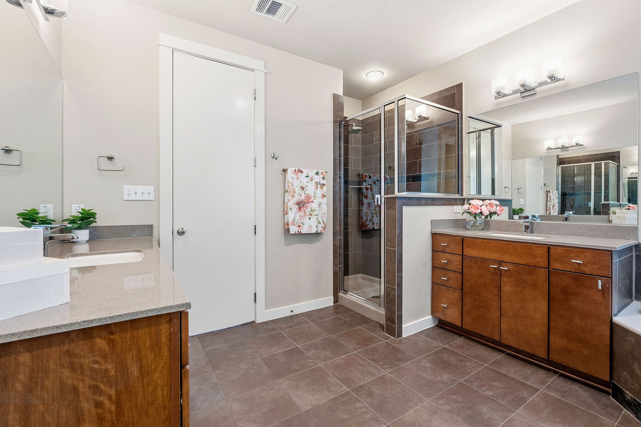 2911 Corbin Lane Austin, TX 78704 - Photo 17 of 37 a spacious bathroom with a shower sink and mirror