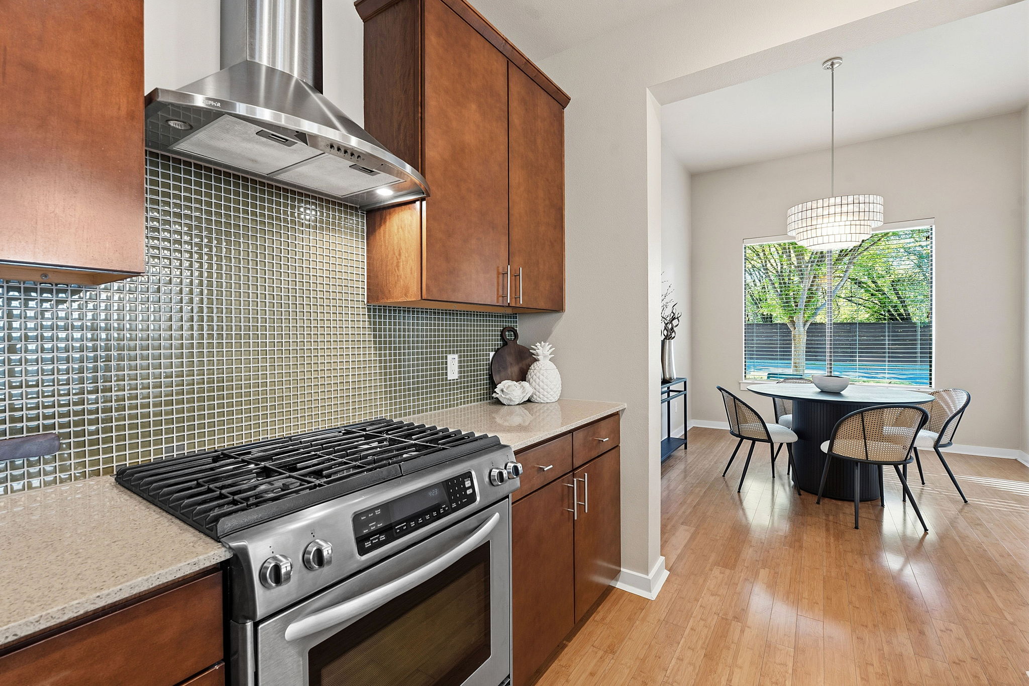 2911 Corbin Lane Austin, TX 78704 - Photo 7 of 37 a kitchen with a stove and wooden floor