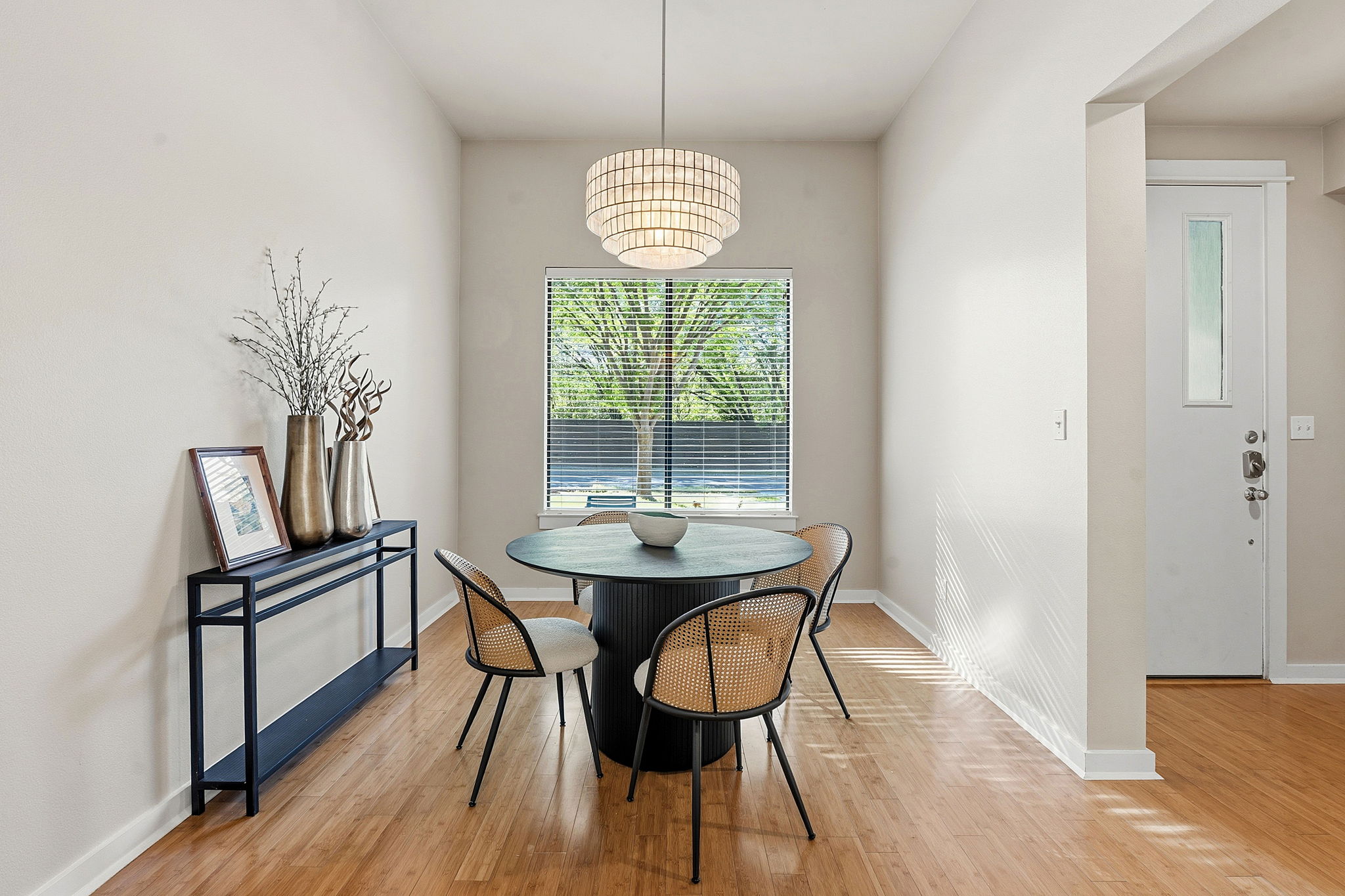 2911 Corbin Lane Austin, TX 78704 - Photo 9 of 37 a dining room with furniture a chandelier and wooden floor