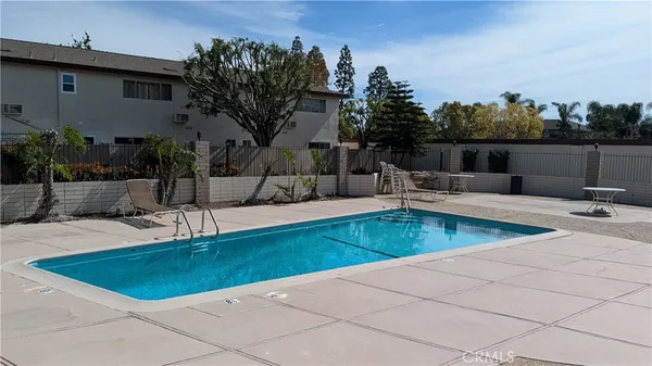 a view of a swimming pool with a patio