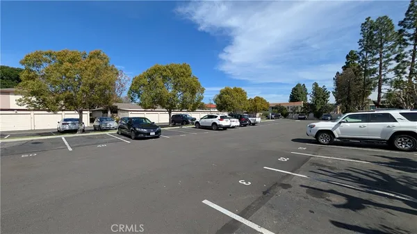 a view of street with parked cars