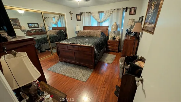 a bedroom with furniture and a window