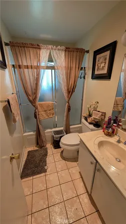a bathroom with a sink toilet and mirror