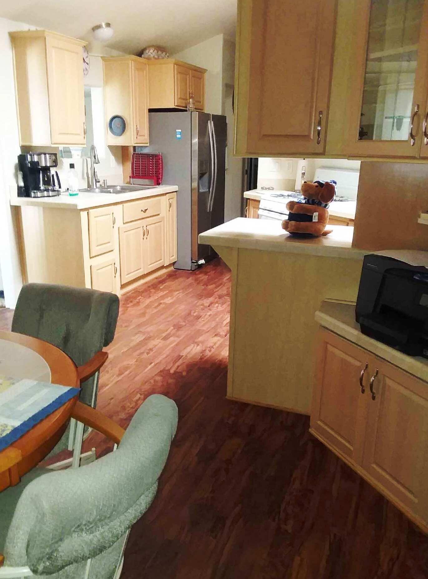 84136 Ave 44, Unit 593 Indio, CA 92203 - Photo 12 of 31 a kitchen with granite countertop a sink cabinets and stainless steel appliances