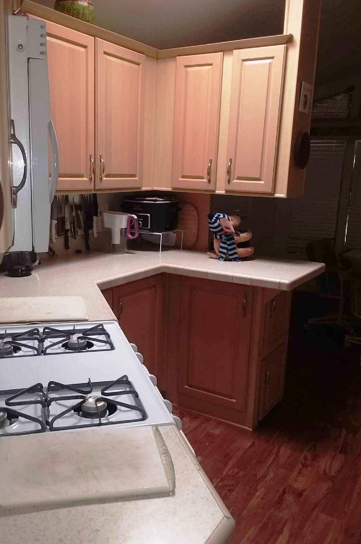 84136 Ave 44, Unit 593 Indio, CA 92203 - Photo 14 of 31 a white stove top oven sitting inside of a kitchen