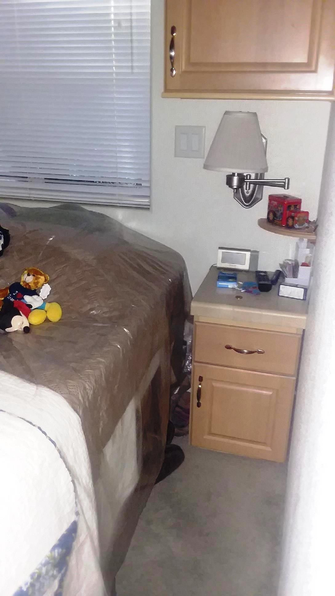 84136 Ave 44, Unit 593 Indio, CA 92203 - Photo 24 of 31 a bedroom with a bed and ceiling fan