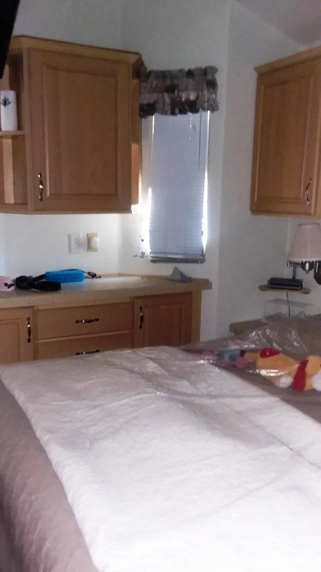 84136 Ave 44, Unit 593 Indio, CA 92203 - Photo 25 of 31 a kitchen with a sink and cabinets