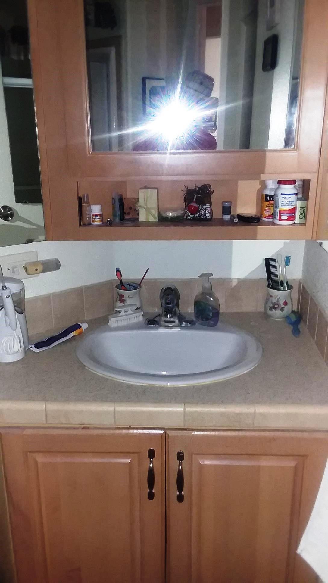 84136 Ave 44, Unit 593 Indio, CA 92203 - Photo 29 of 31 a bathroom with a sink and a mirror