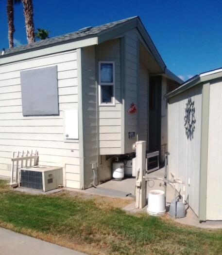 84136 Ave 44, Unit 593 Indio, CA 92203 - Photo 5 of 31 a front view of a house with garden