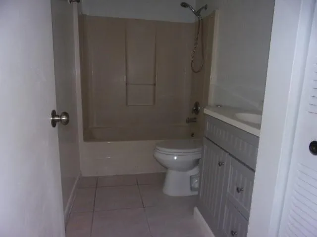 a bathroom with a toilet and shower