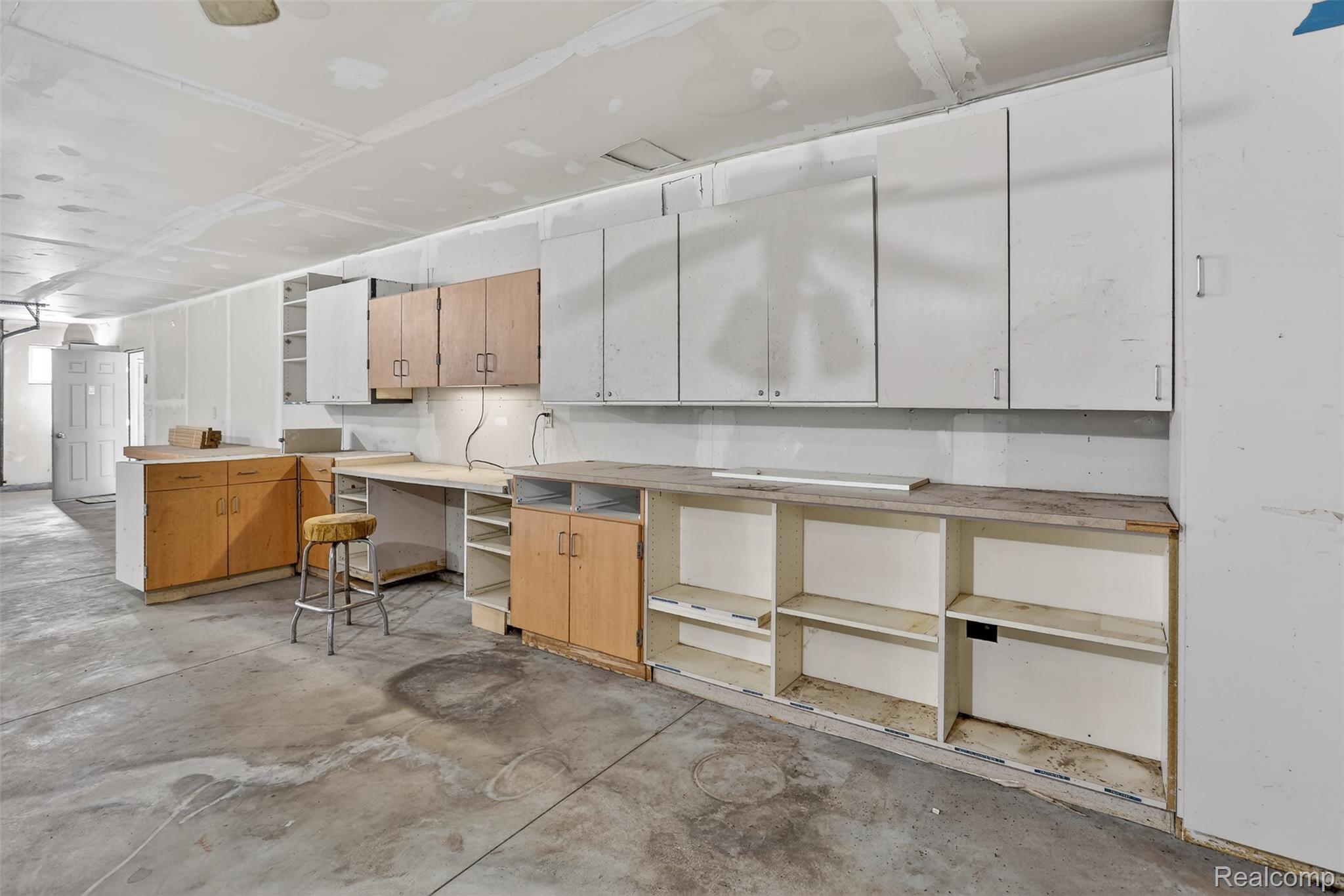 3241 Curtis Road Birch Run, MI 48415 - Photo 38 of 47 Kitchen featuring unfinished concrete floors, light countertops, and a peninsula