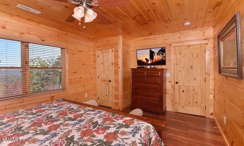 2456 Hackberry Drive Sevierville, TN 37862 - Photo 19 of 25 a bedroom with a bed and a dresser