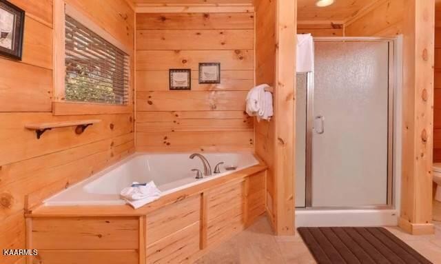 2456 Hackberry Drive Sevierville, TN 37862 - Photo 21 of 25 a bathroom with a tub sink and shower