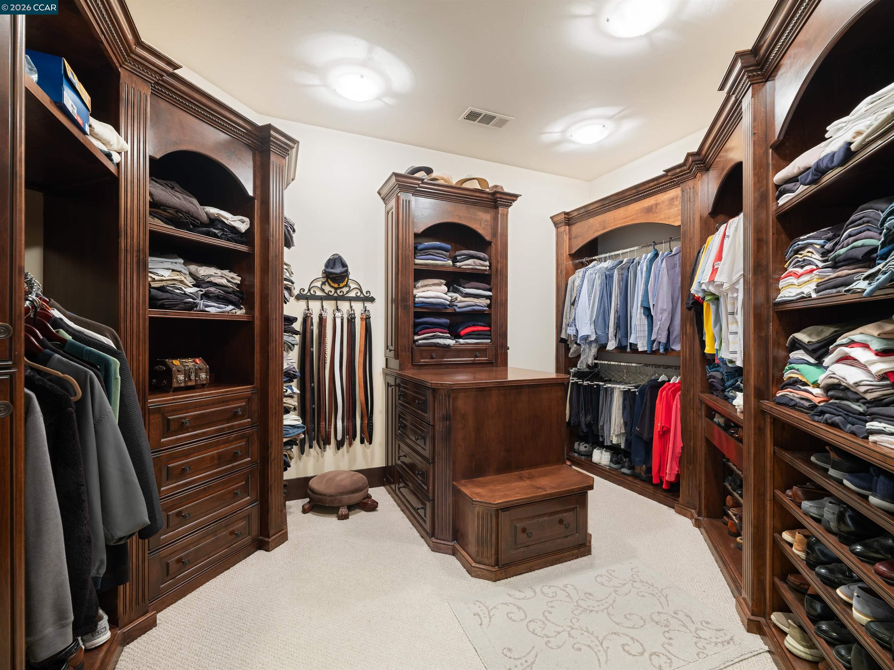 2020 Victorine Road Livermore, CA 94551 - Photo 43 of 99 a living room with furniture a flat screen tv and a walk in closet