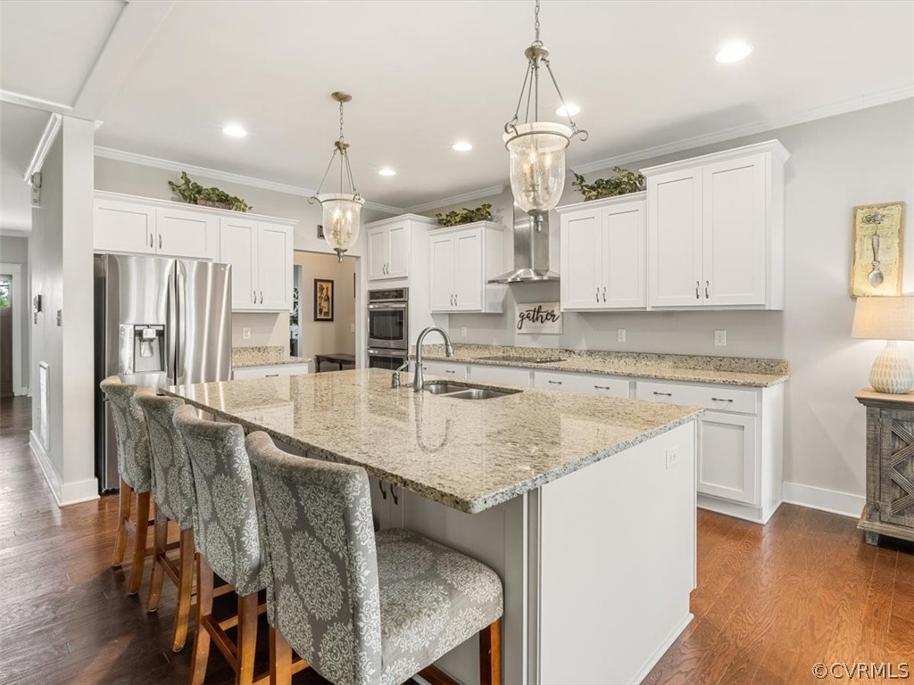 16424 Lambourne Road Midlothian, VA 23112 - Photo 11 of 32 a kitchen with stainless steel appliances granite countertop a sink oven and white cabinets
