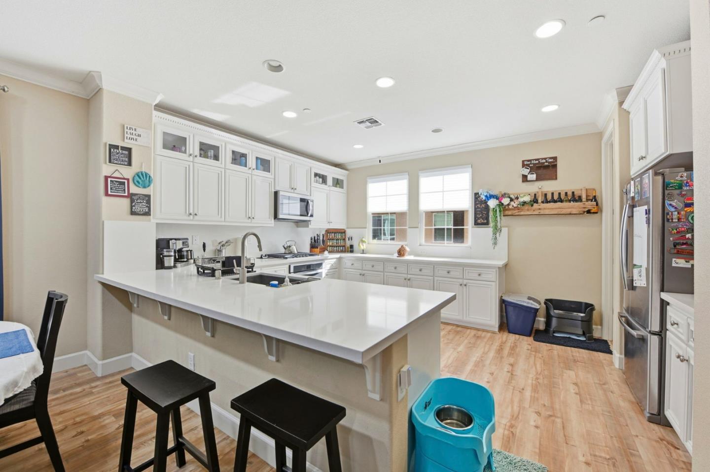 56 Regency Place Hayward, CA 94544 - Photo 12 of 43 a kitchen with stainless steel appliances granite countertop a sink a stove a refrigerator cabinets and dining table