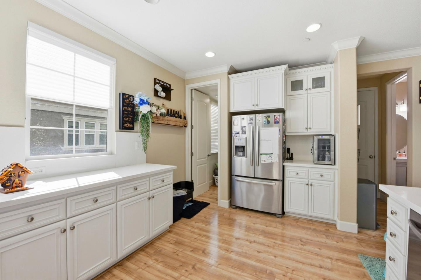56 Regency Place Hayward, CA 94544 - Photo 16 of 43 a kitchen with white cabinets and stainless steel appliances