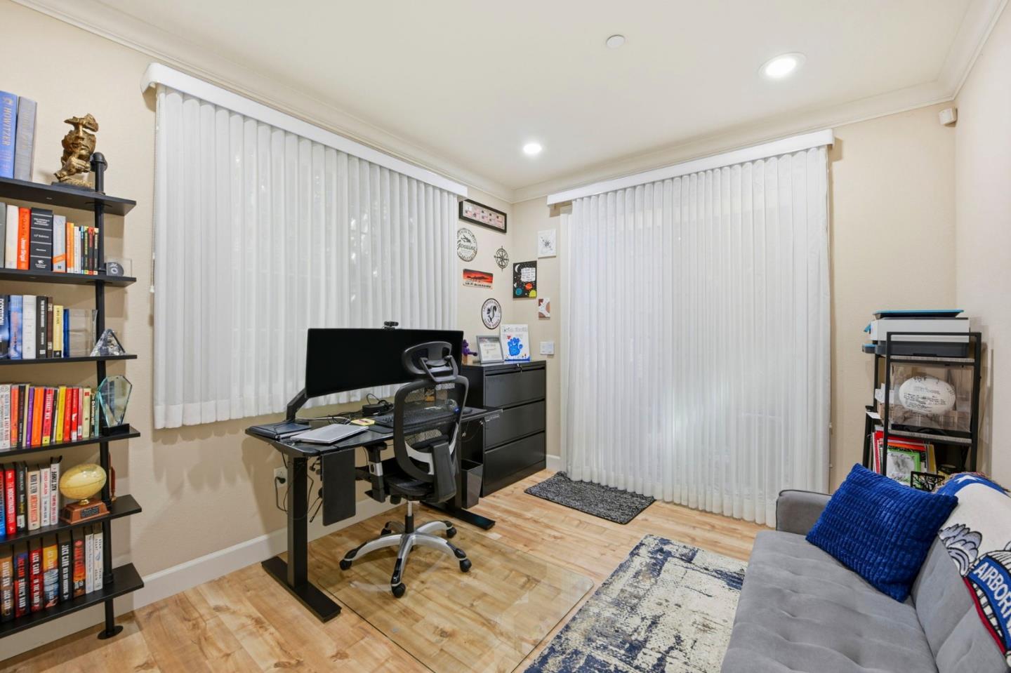 56 Regency Place Hayward, CA 94544 - Photo 17 of 43 a workspace with furniture and a book shelf