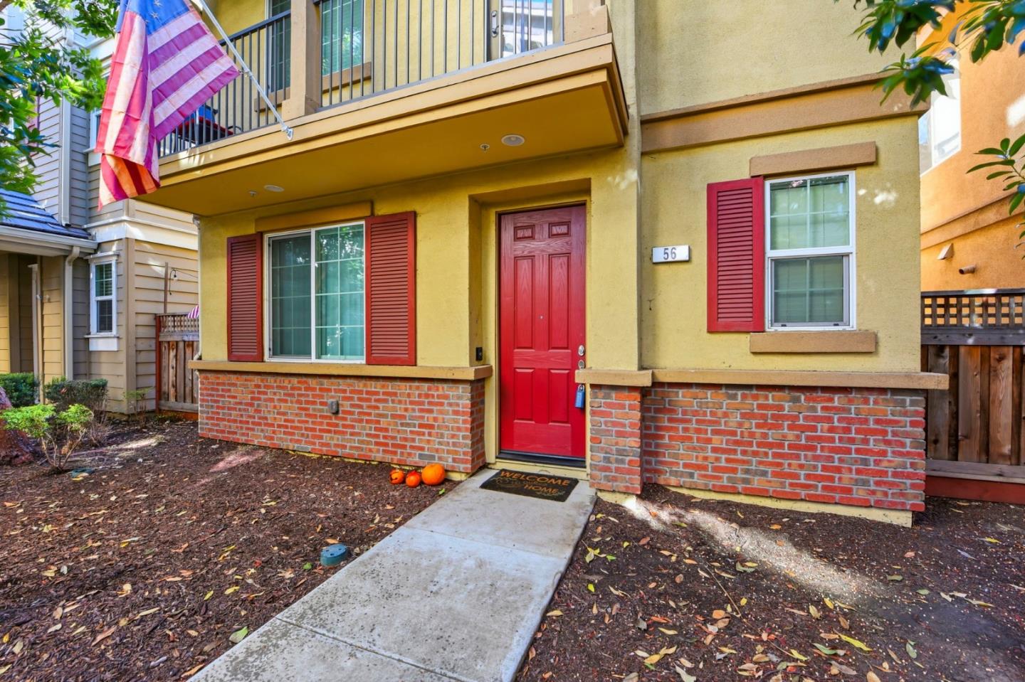 56 Regency Place Hayward, CA 94544 - Photo 3 of 43 front view of a brick house with large windows