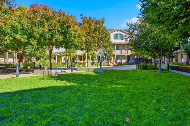 a front view of building with yard and green space