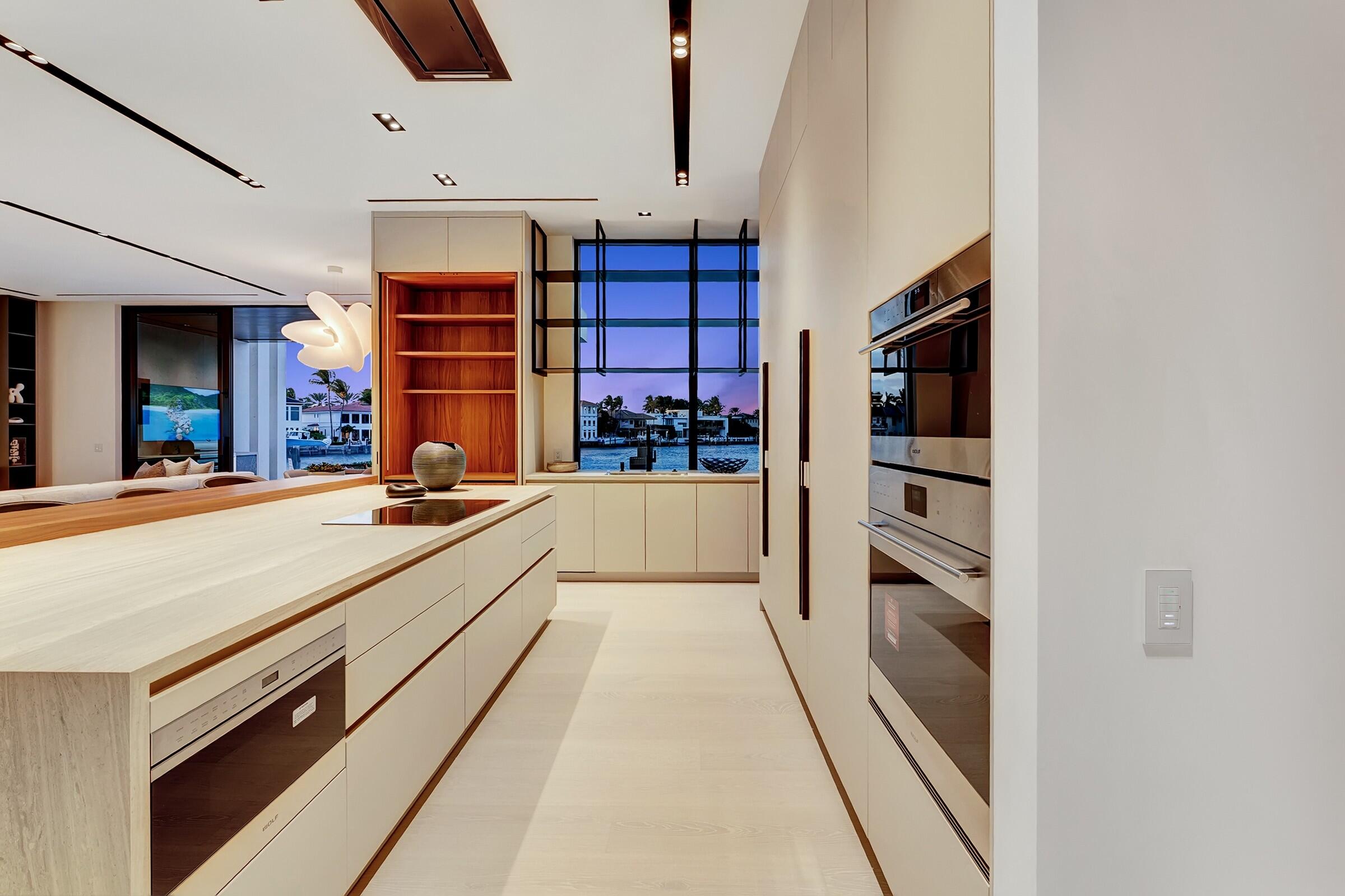 829 Orchid Drive Boca Raton, FL 33432 - Photo 11 of 102 a large kitchen with stainless steel appliances a stove and cabinets