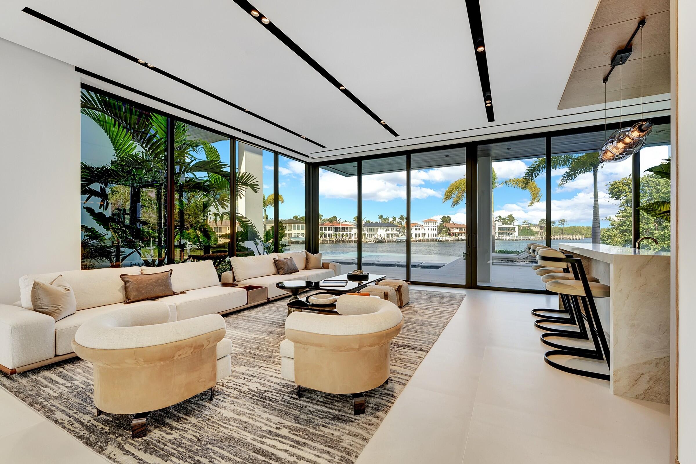 829 Orchid Drive Boca Raton, FL 33432 - Photo 19 of 102 a living room with furniture and a floor to ceiling window