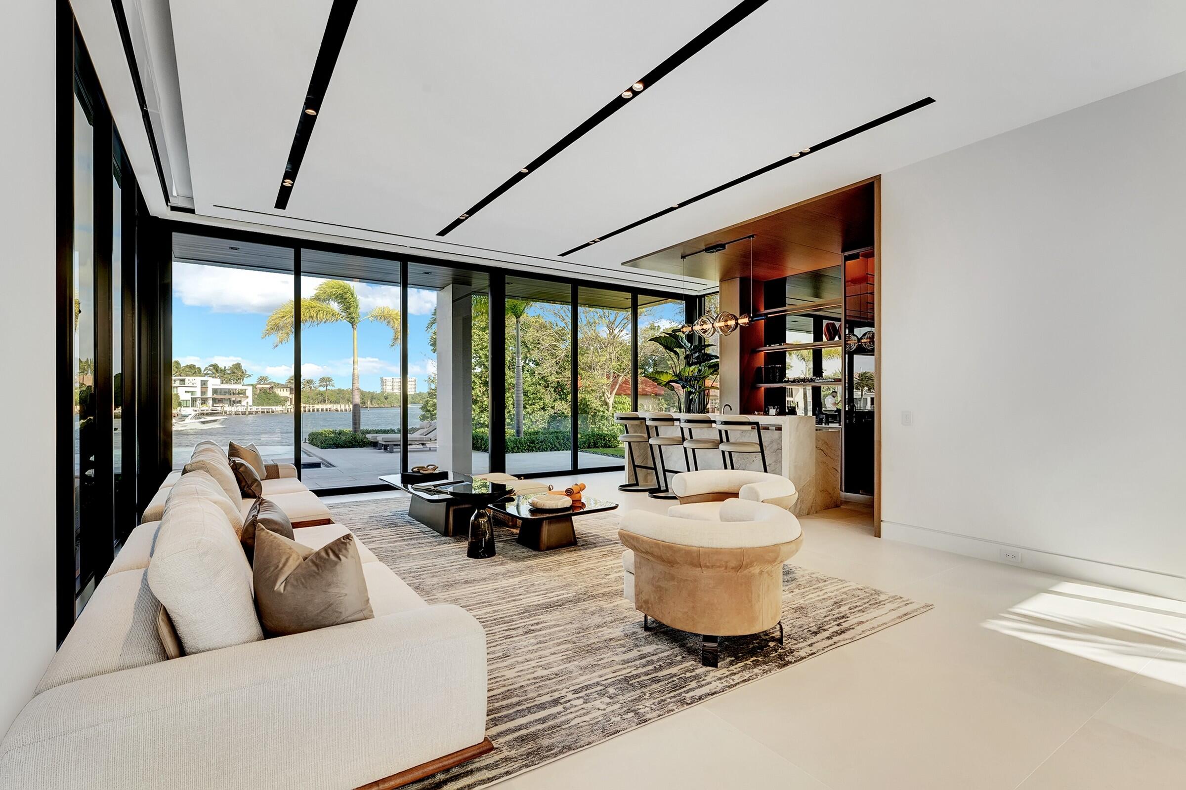 829 Orchid Drive Boca Raton, FL 33432 - Photo 20 of 102 a living room with furniture and a floor to ceiling window