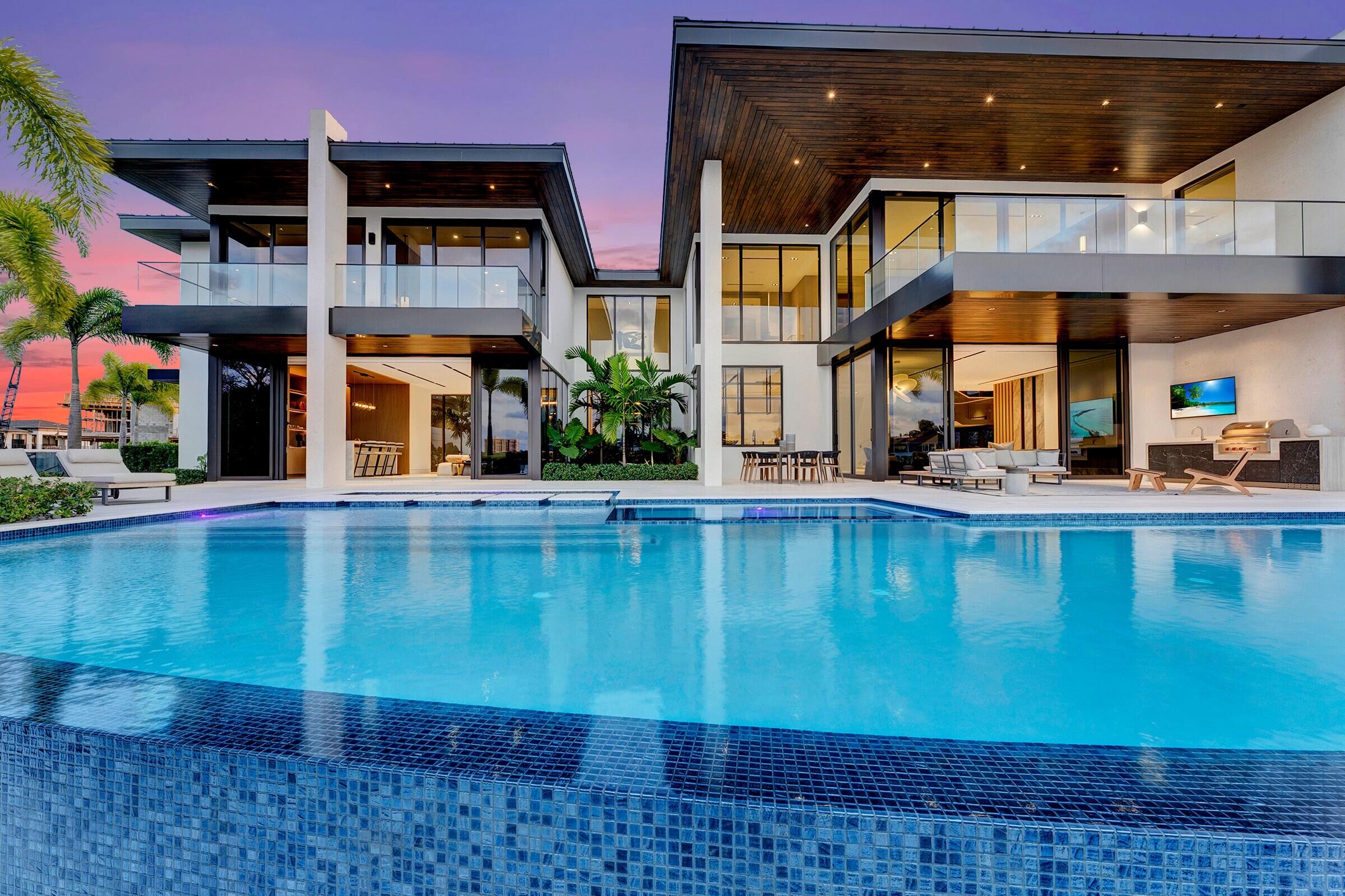 829 Orchid Drive Boca Raton, FL 33432 - Photo 2 of 102 a view of a building with a swimming pool