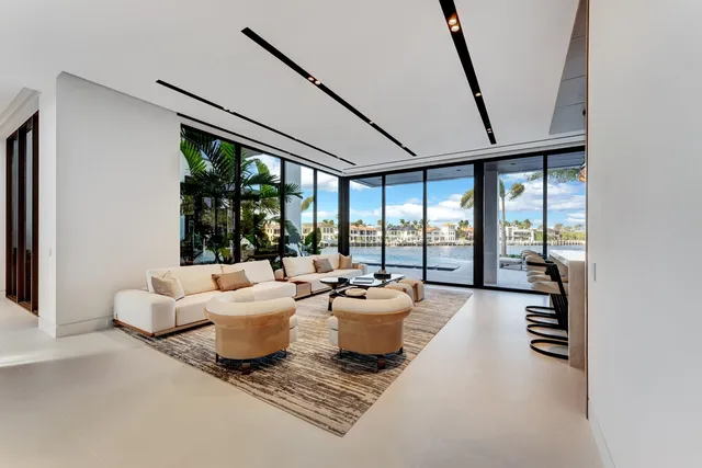 a dining room with furniture window and wooden floor