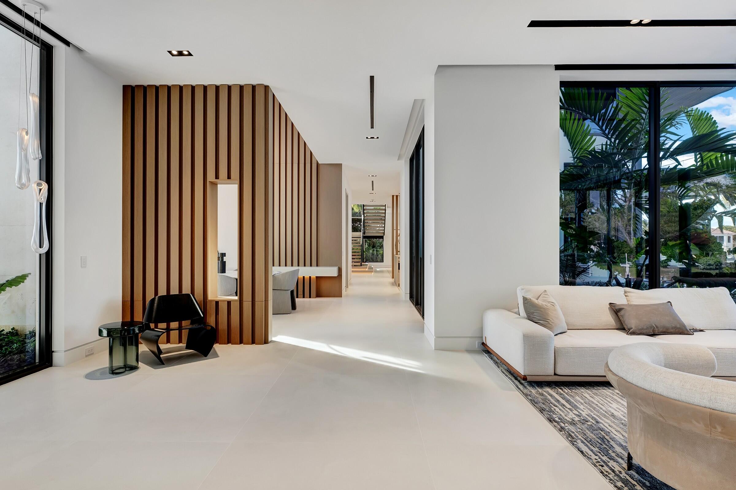 829 Orchid Drive Boca Raton, FL 33432 - Photo 24 of 102 a living room with furniture and a large window