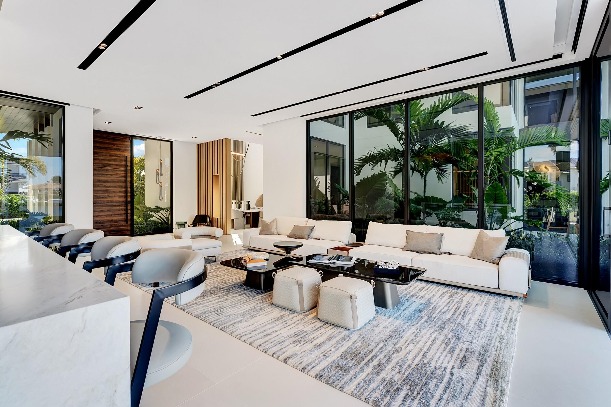 829 Orchid Drive Boca Raton, FL 33432 - Photo 29 of 102 a living room with furniture large windows and a large window