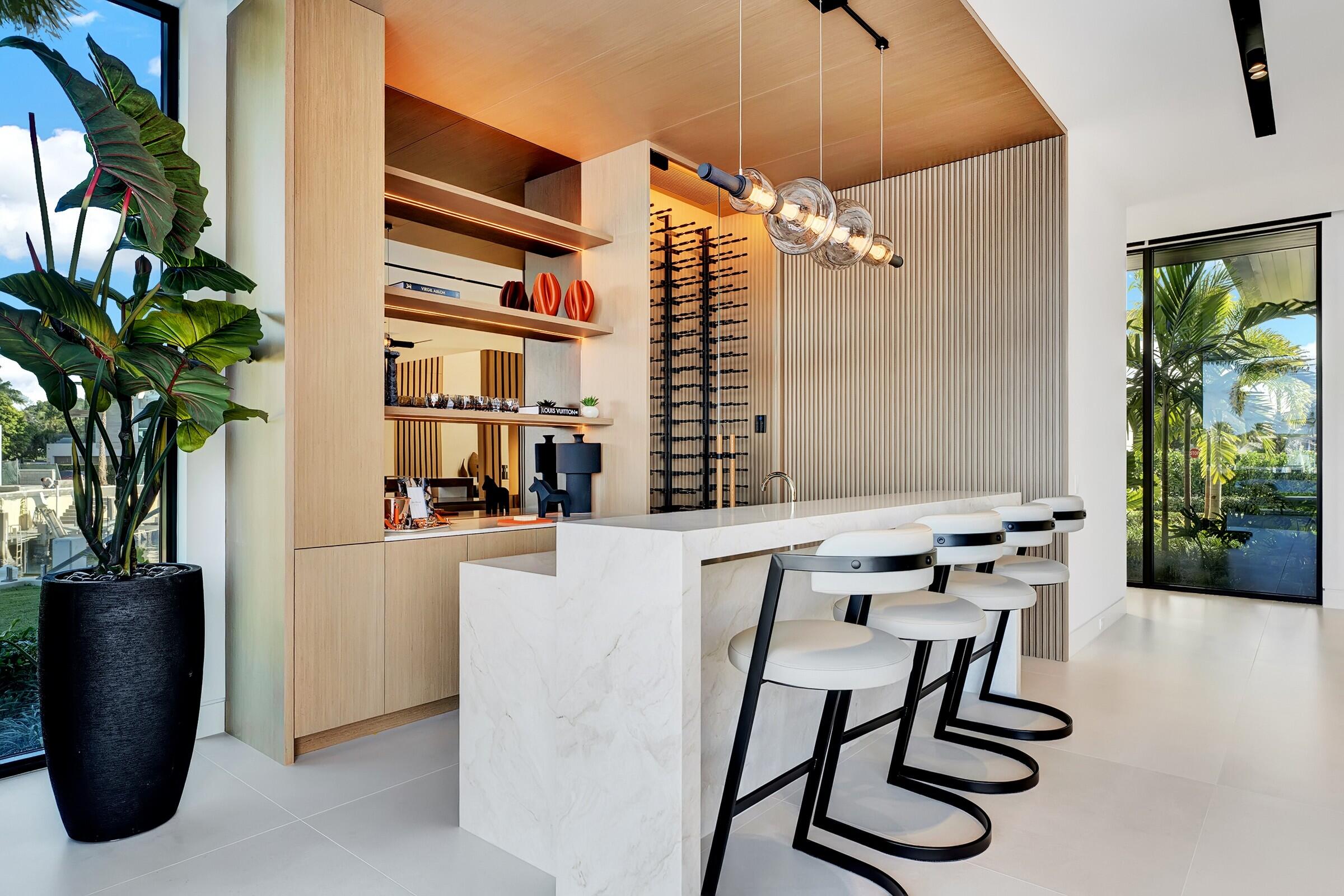 829 Orchid Drive Boca Raton, FL 33432 - Photo 31 of 102 a dining room with furniture and a potted plant