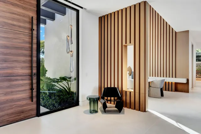 a bedroom with a large bed and a large window