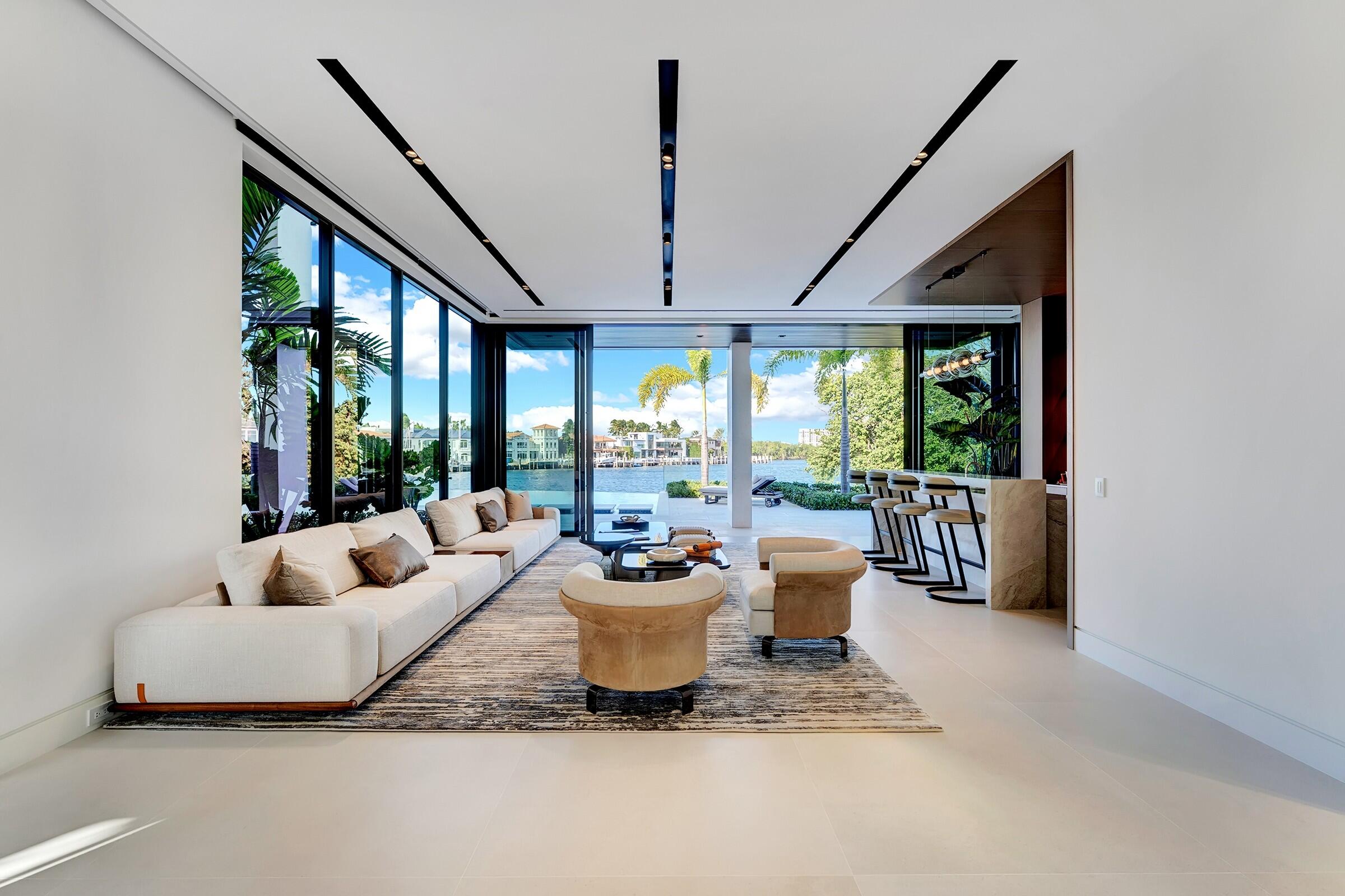 829 Orchid Drive Boca Raton, FL 33432 - Photo 33 of 102 a living room with furniture and large windows