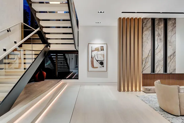 a view of a glass door with a floor to ceiling window next to a yard