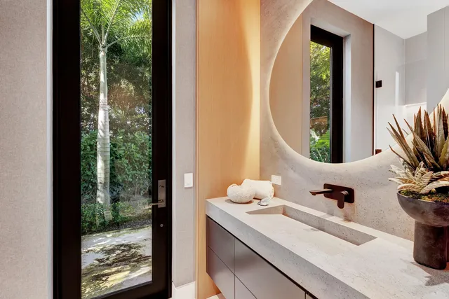 a bedroom with bed and glass door