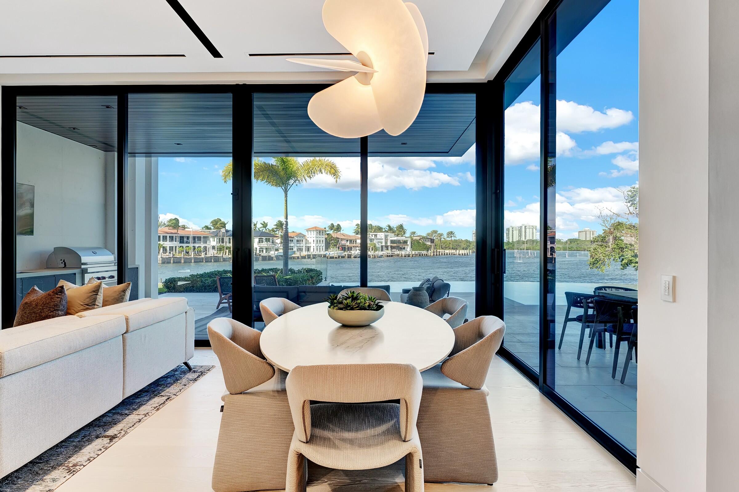 829 Orchid Drive Boca Raton, FL 33432 - Photo 47 of 102 a dining room with furniture and a large window