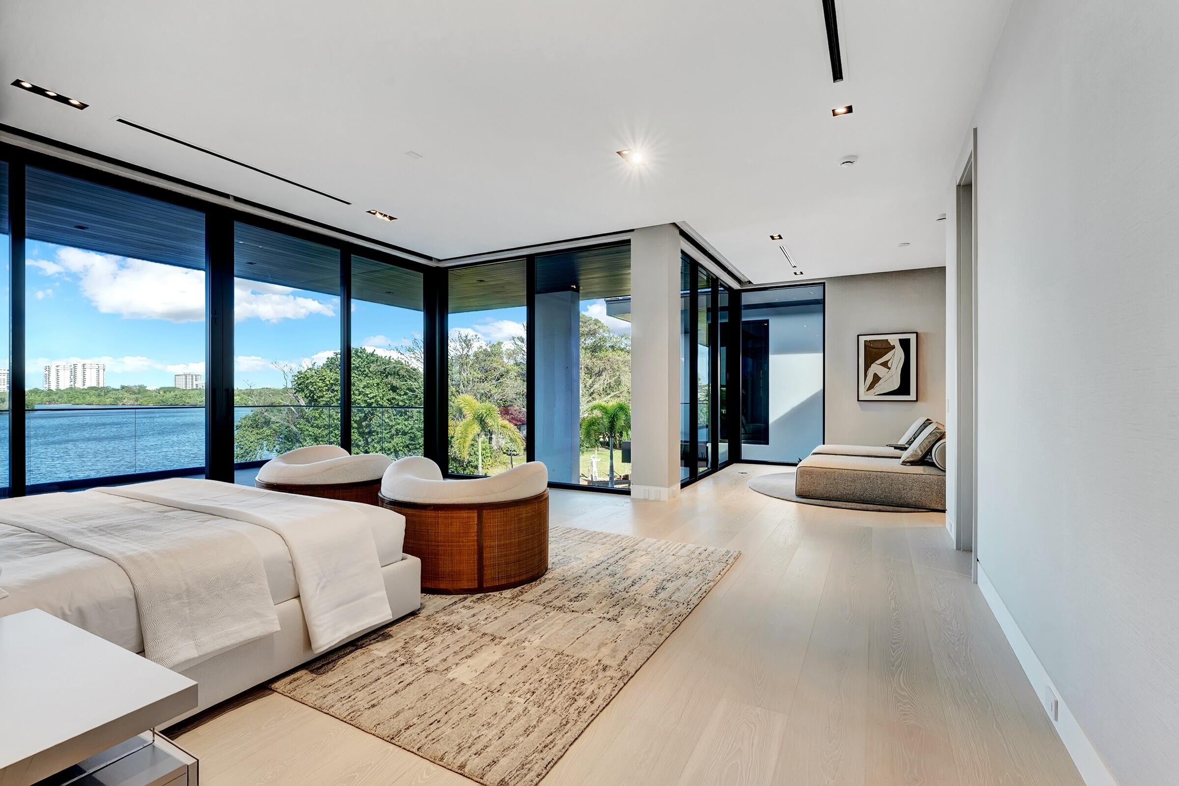 829 Orchid Drive Boca Raton, FL 33432 - Photo 61 of 102 a bedroom with a large bed and a large window