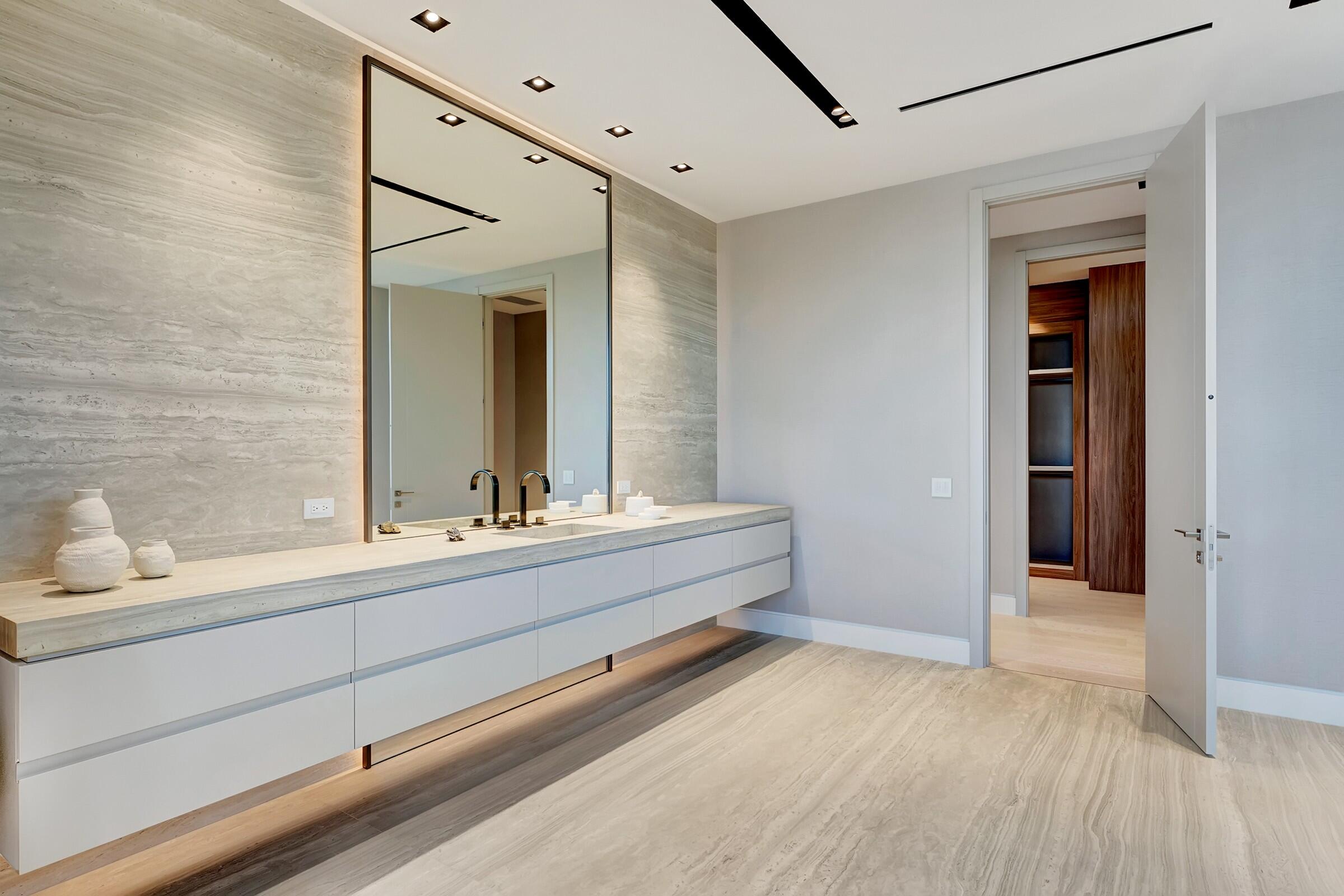 829 Orchid Drive Boca Raton, FL 33432 - Photo 63 of 102 a bathroom with a sink and a mirror