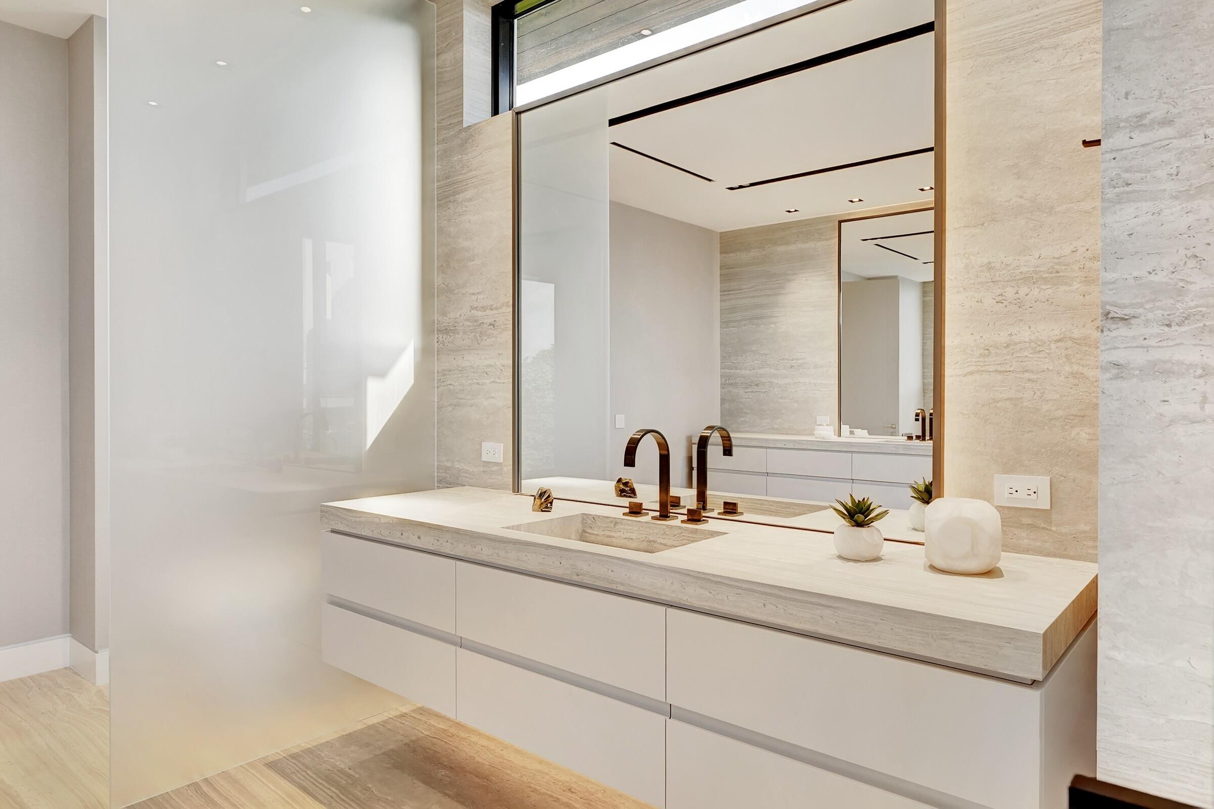 829 Orchid Drive Boca Raton, FL 33432 - Photo 64 of 102 a bathroom with a sink and a mirror