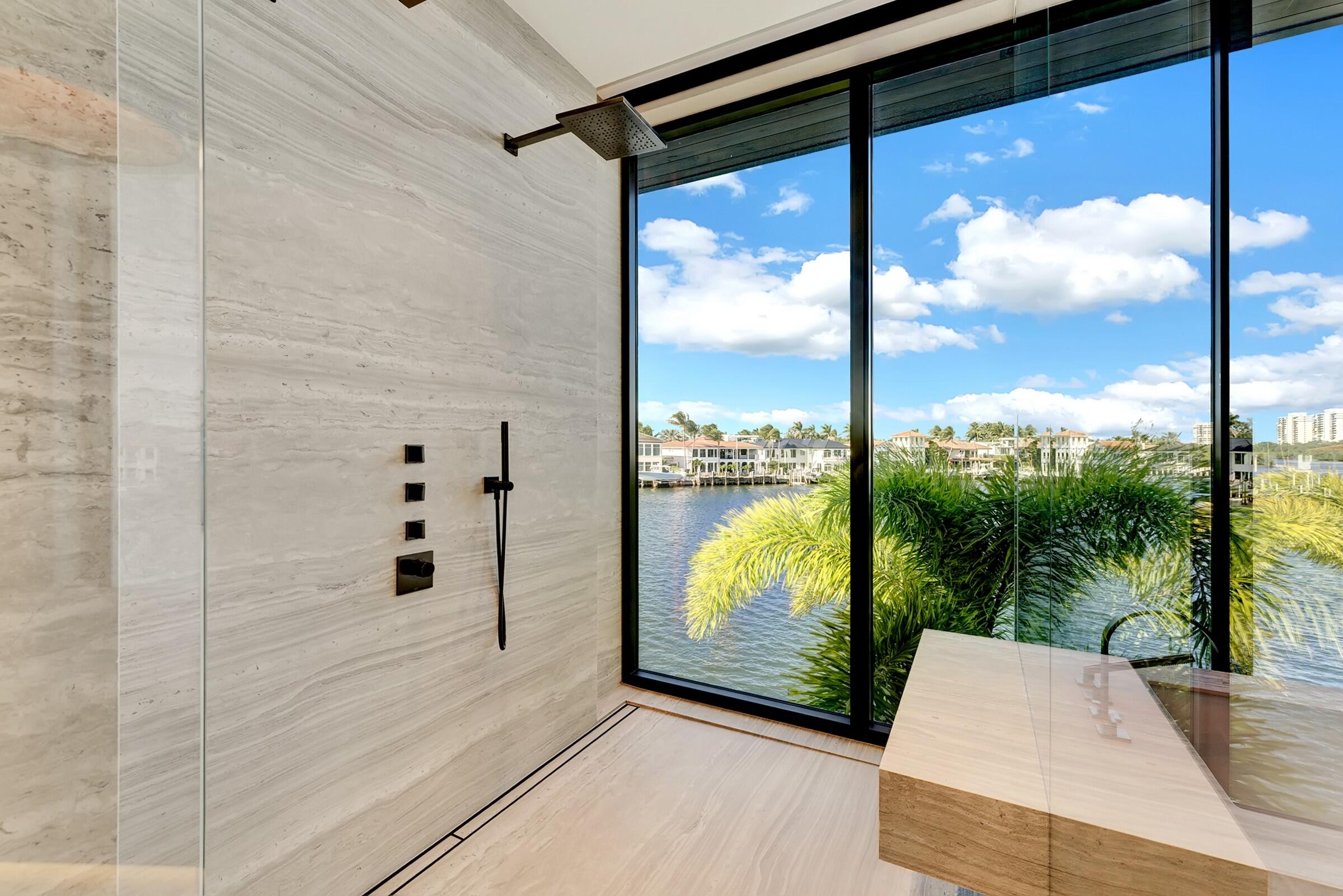 829 Orchid Drive Boca Raton, FL 33432 - Photo 67 of 102 a view of a glass door with a floor to ceiling window next to a yard