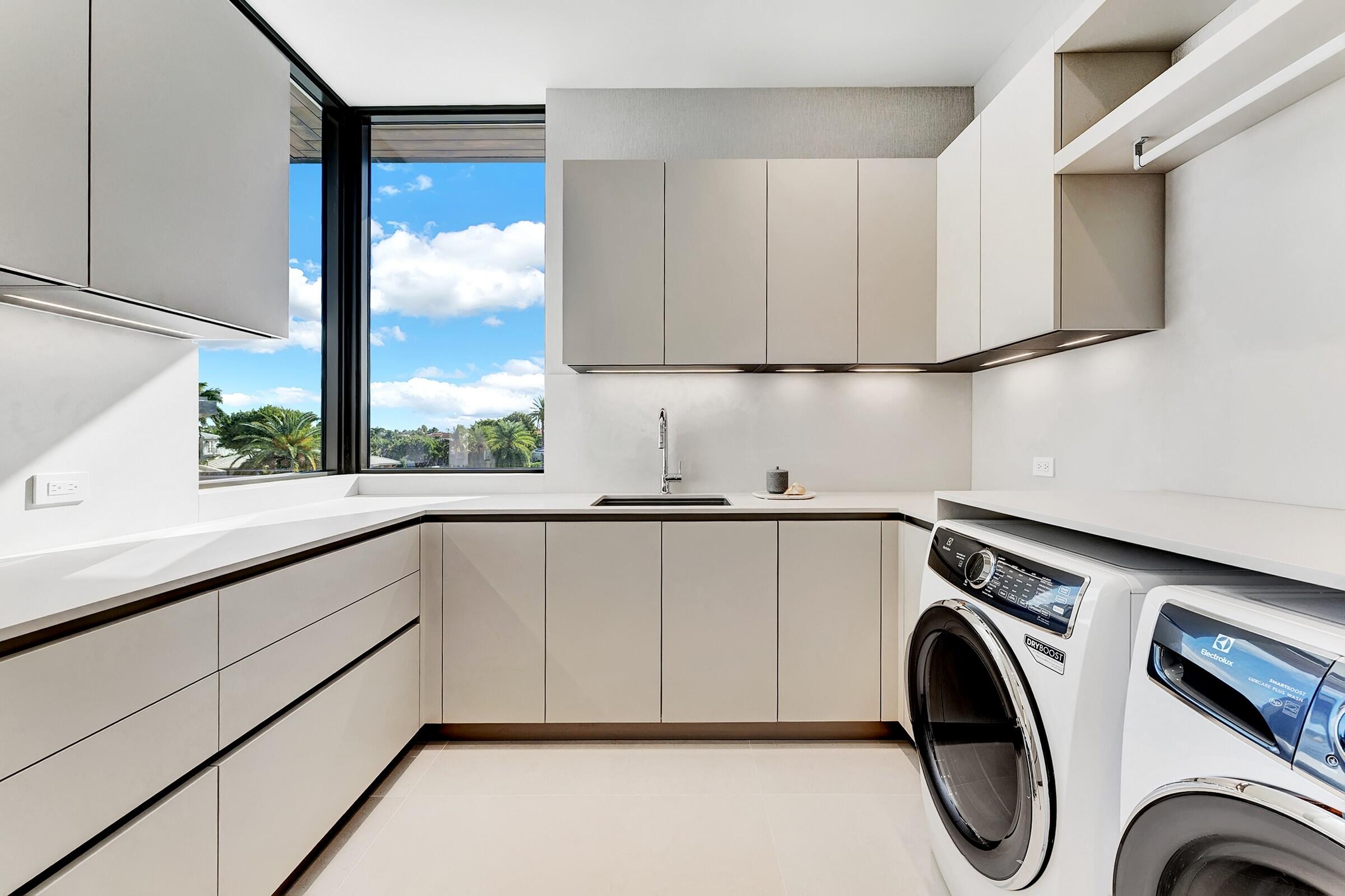 829 Orchid Drive Boca Raton, FL 33432 - Photo 71 of 102 a view of a kitchen with washer and dryer