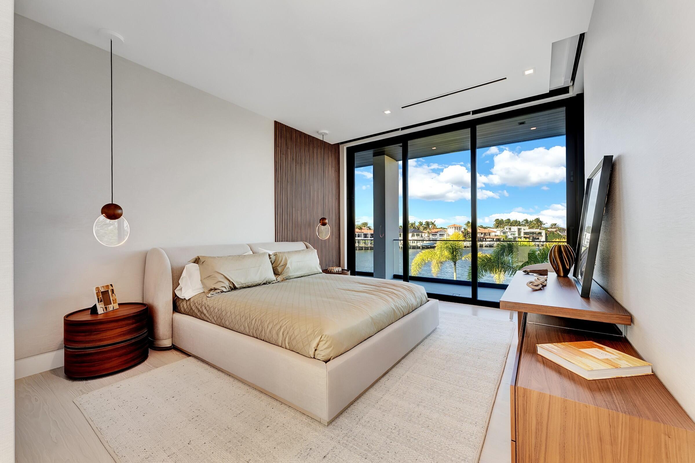 829 Orchid Drive Boca Raton, FL 33432 - Photo 78 of 102 a living room with a large bed and a large window
