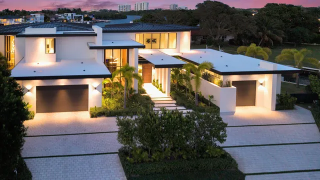 a view of kitchen island with stainless steel appliances kitchen island a table and chairs in it
