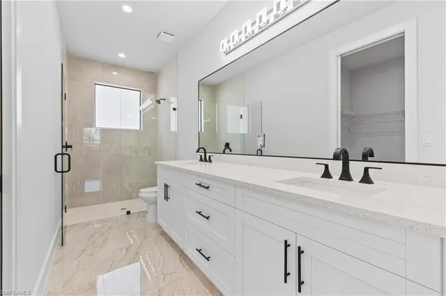 an empty room with a window and a ceiling fan