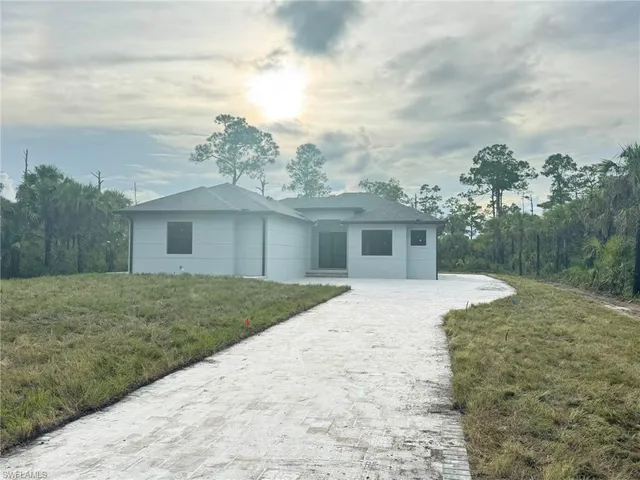 a view of a kitchen with a sink and stainless steel appliances