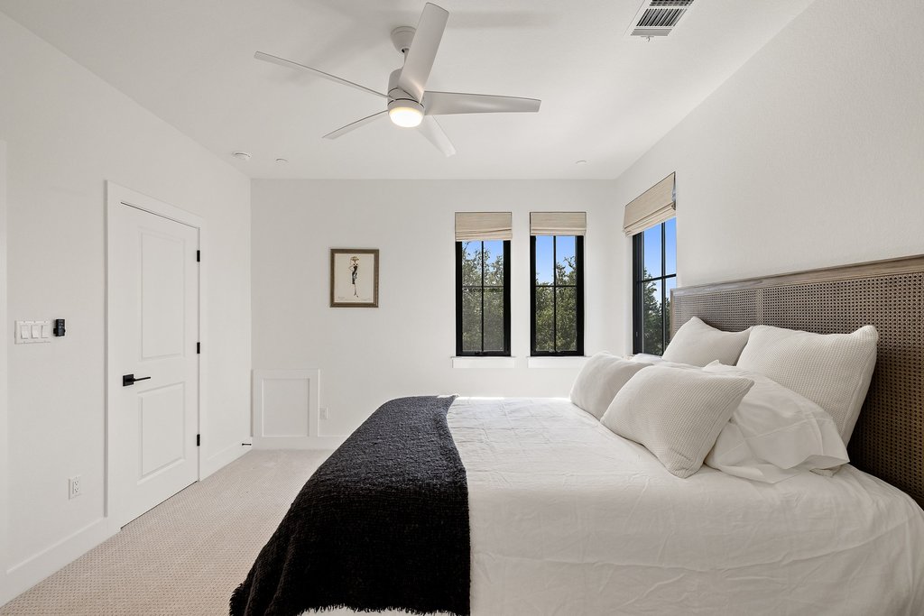 7516 Davenport Divide Road Austin, TX 78738 - Photo 29 of 40 Bedroom 4 - enjoy wonderful natural light and tree-lined views.