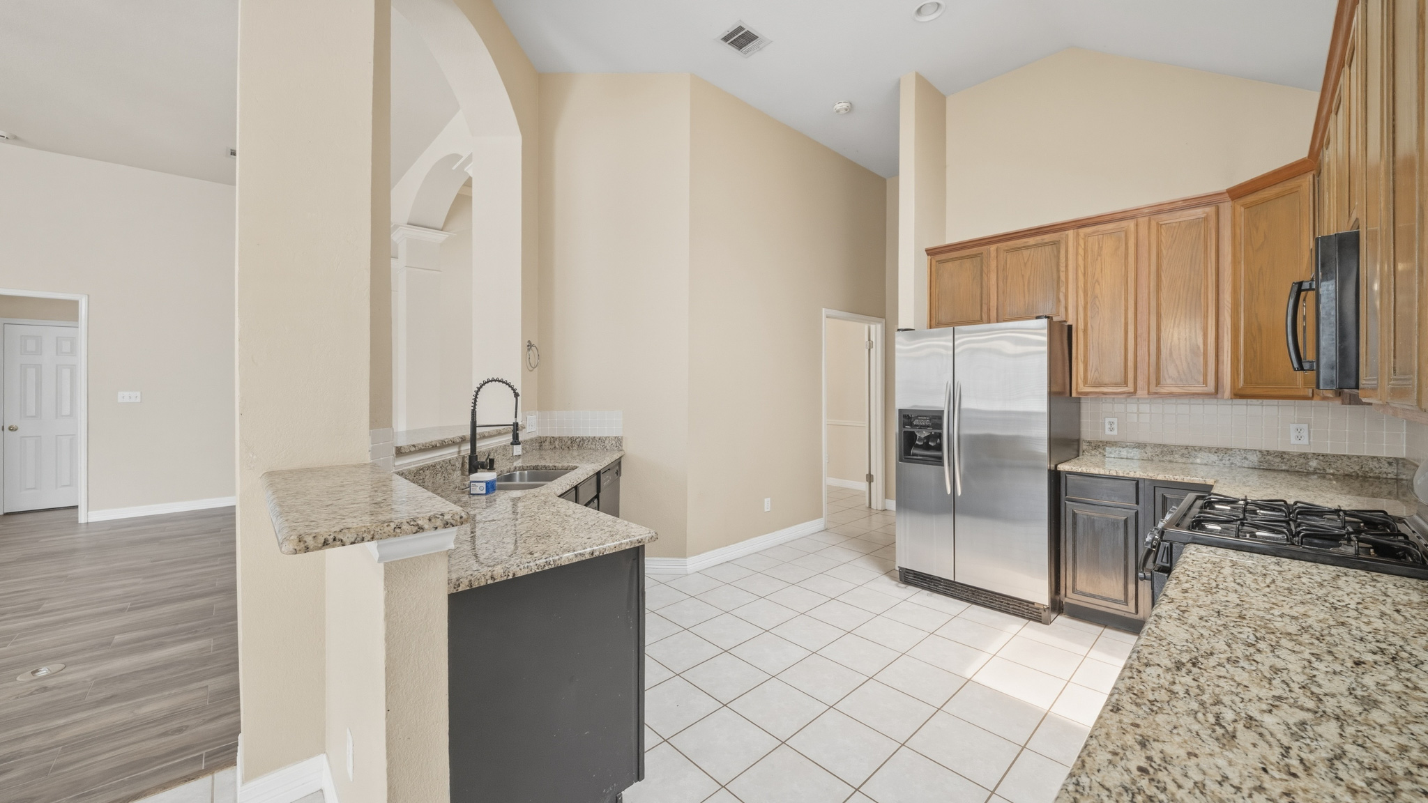 1108 Antelope Ridge Cedar Park, TX 78613 - Photo 8 of 27 Culinary aspirations ignite in this well-appointed kitchen, featuring ample granite counter space and contemporary appliances.