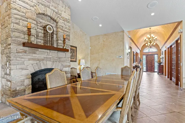 a kitchen with sink table and chairs